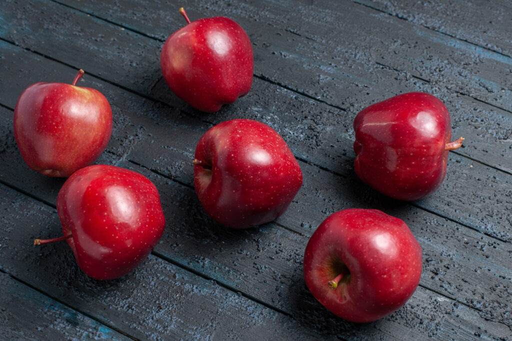 front view fresh red apples mellow ripe fruits dark blue desk fruit color red plant vitamine fresh (1)